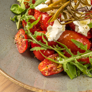 Cycladic style with dried cherry tomatoes, thyme, goat cheese, capers and rusk
