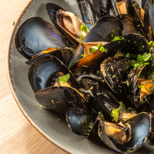 Fresh mussels sautéed with thyme or “saganaki style” with tomato and feta cheese