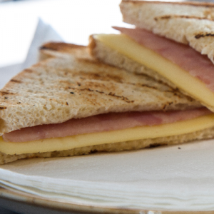 Toast classic made with whole grain or white bread, yellow cheese, pork shoulder or turkey