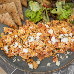 Kagianas on rustic bread with freshly grated tomato, feta and oregano