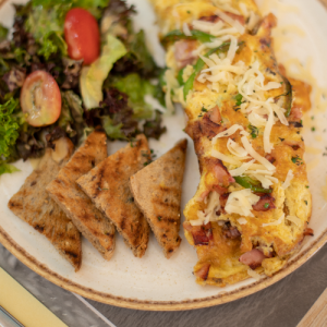 Omelet with goat cheese, roasted zucchini, caramelized onions and spinach