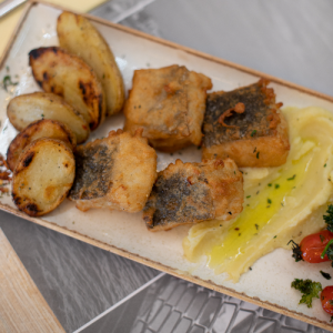 Fried battered cod with garlic dip and baby potatoes