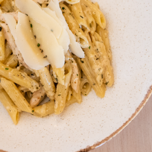 Penne with chicken fillets deglazed with cognac in an estragon cream sauce
