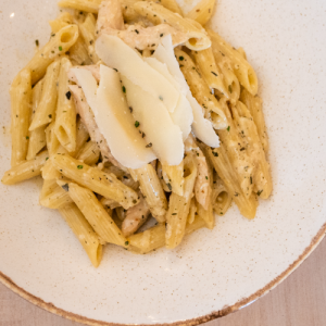 Penne with chicken fillets deglazed with cognac in an estragon cream sauce - COPY