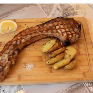 Pork tomahawk (700gr.) with fresh French fries and mustard dip