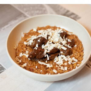 Giouvetsi (orzo) with veal cheeks and Mykonian 