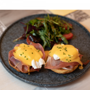 Benedict with poached egg, avocado,-  prosciutto and hollandaise sauce