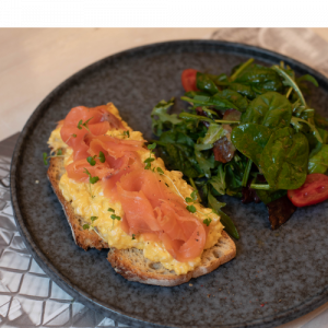 Scrambled eggs on rustic bread with smoked salmon